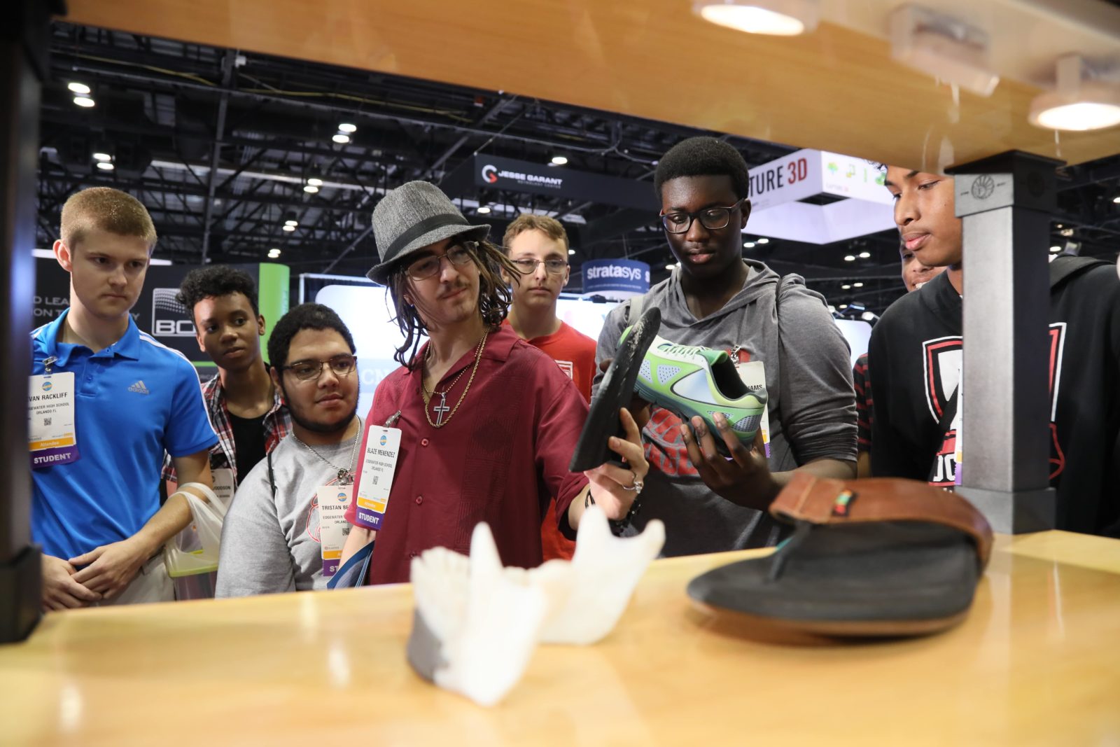 A group looks at an exhibit in the 3D/4D Printing zone